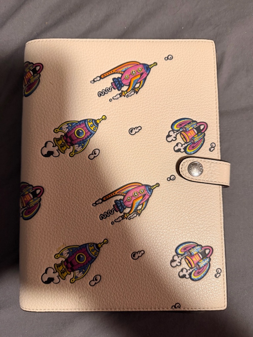 Coach Pink Leather Notebook Cover with Multicolor Rocket Print